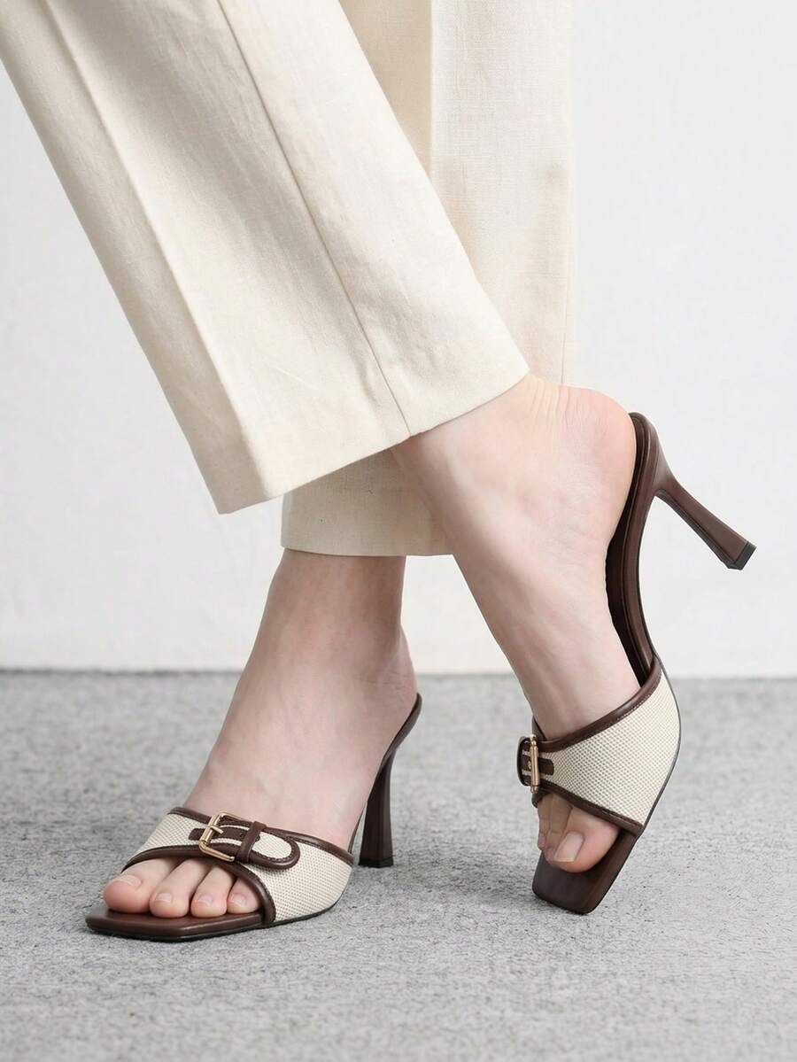 Women's brown open-toe slingback heeled sandals with stiletto heel and buckle strap.