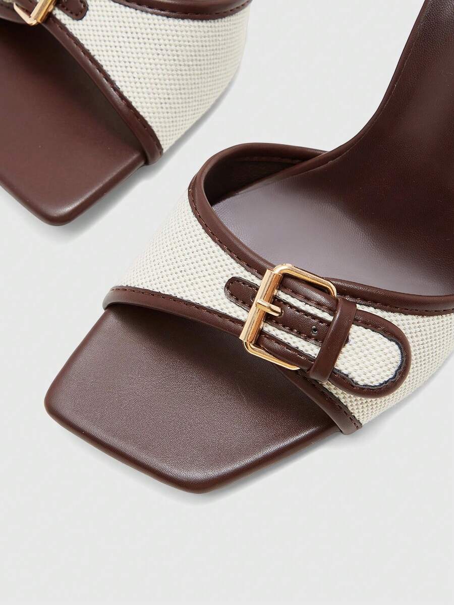 Women's brown open-toe slingback heeled sandals with stiletto heel and buckle strap.