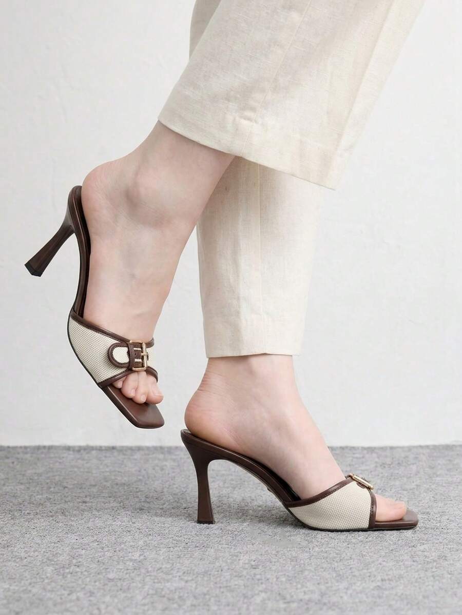 Women's brown open-toe slingback heeled sandals with stiletto heel and buckle strap.