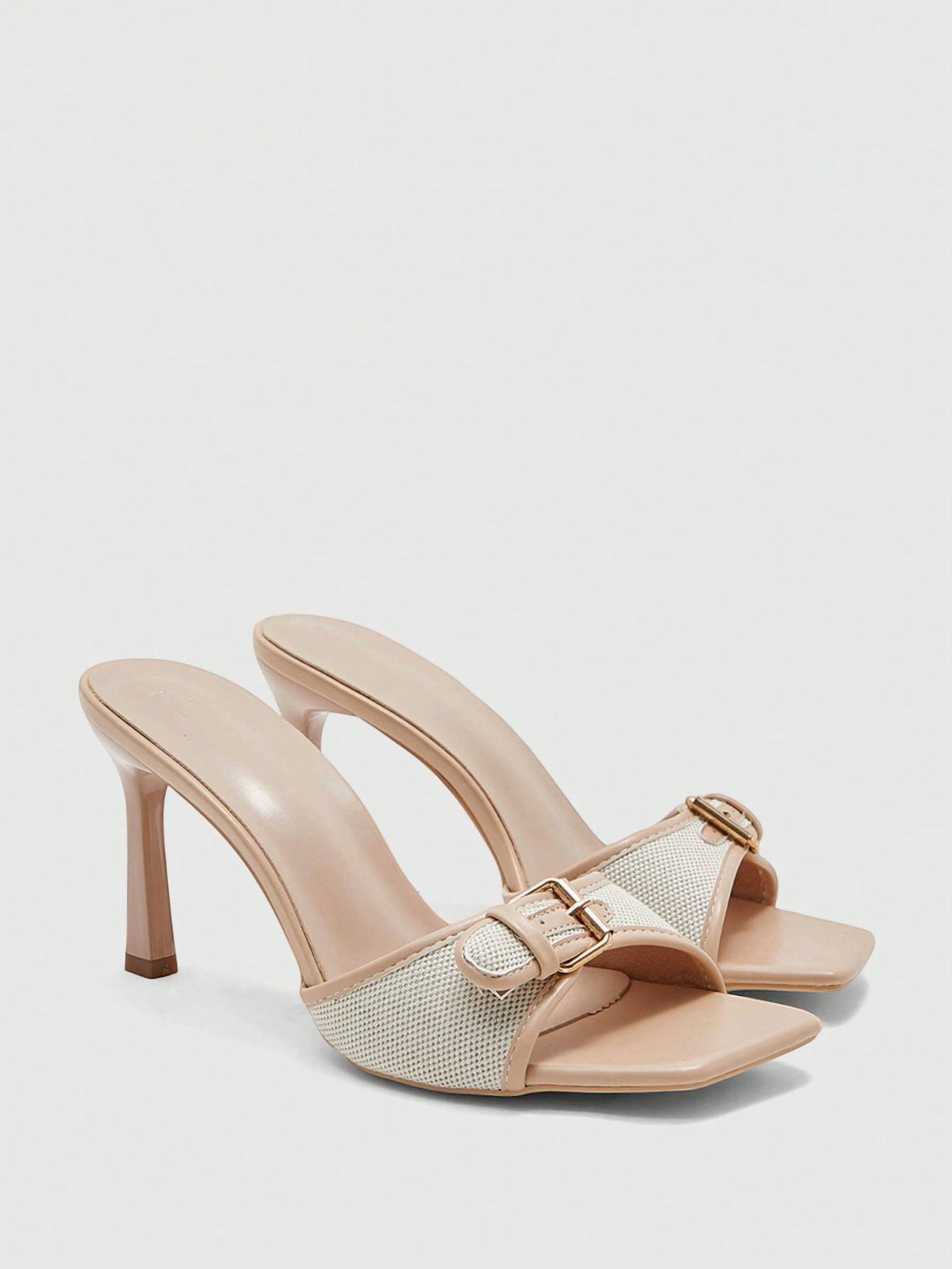 Women's brown open-toe slingback heeled sandals with stiletto heel and buckle strap.
