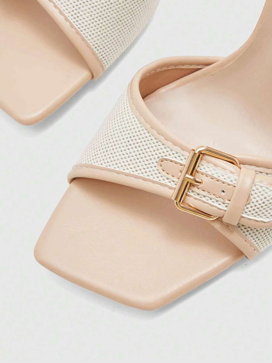 Women's brown open-toe slingback heeled sandals with stiletto heel and buckle strap.