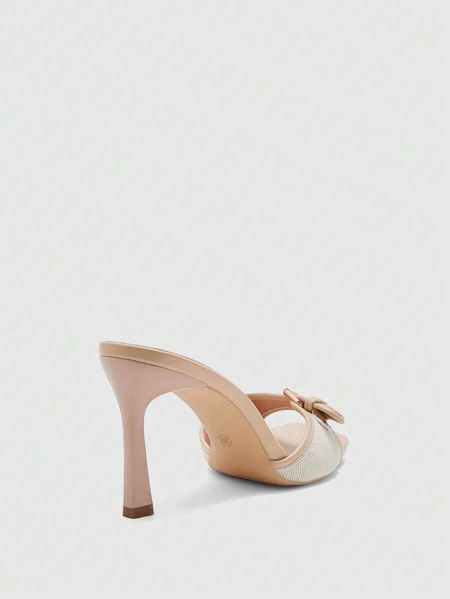 Women's brown open-toe slingback heeled sandals with stiletto heel and buckle strap.