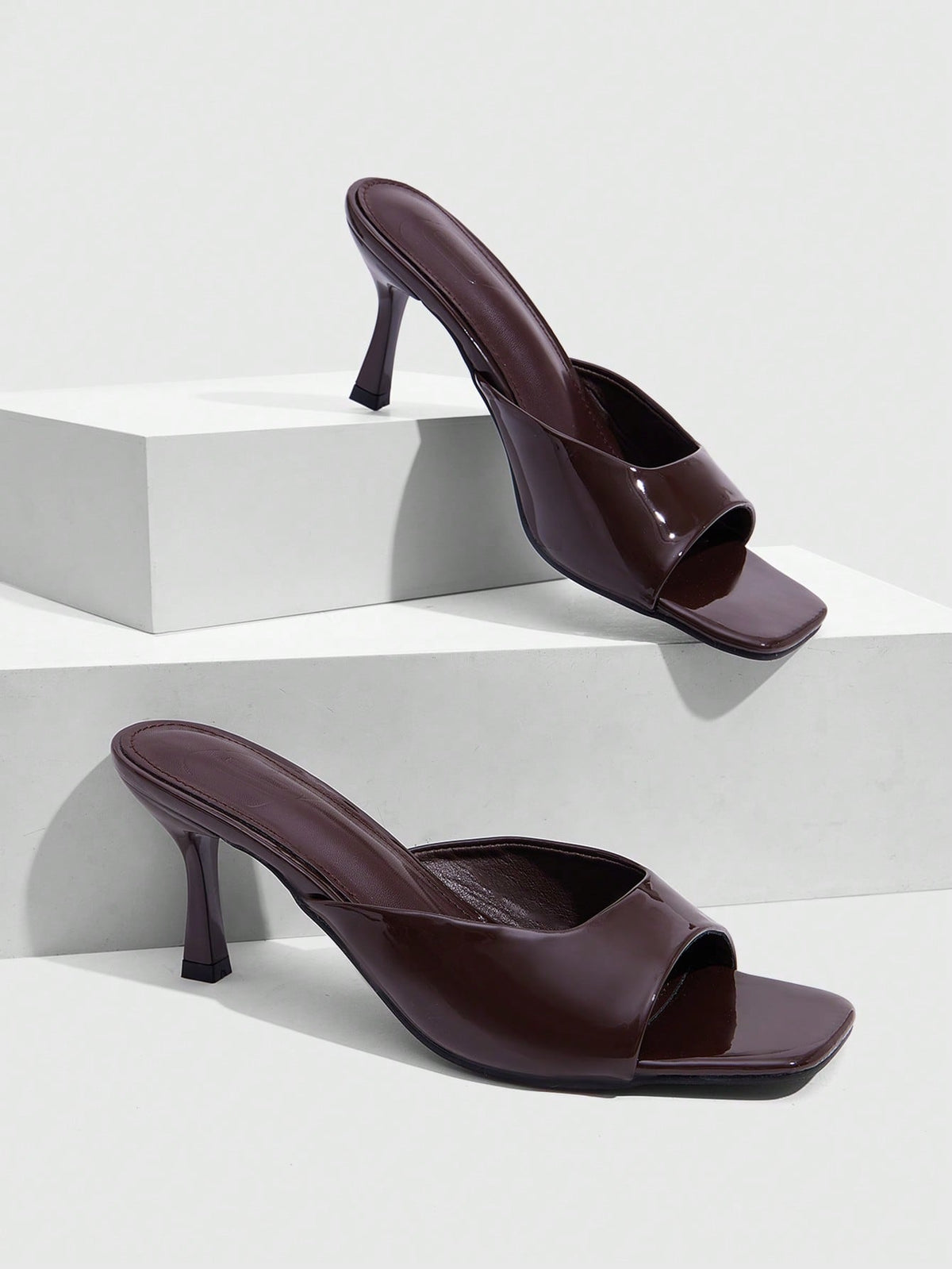 Women's elegant square toe stiletto high heel sandals featuring an open toe and sleek slingback strap
