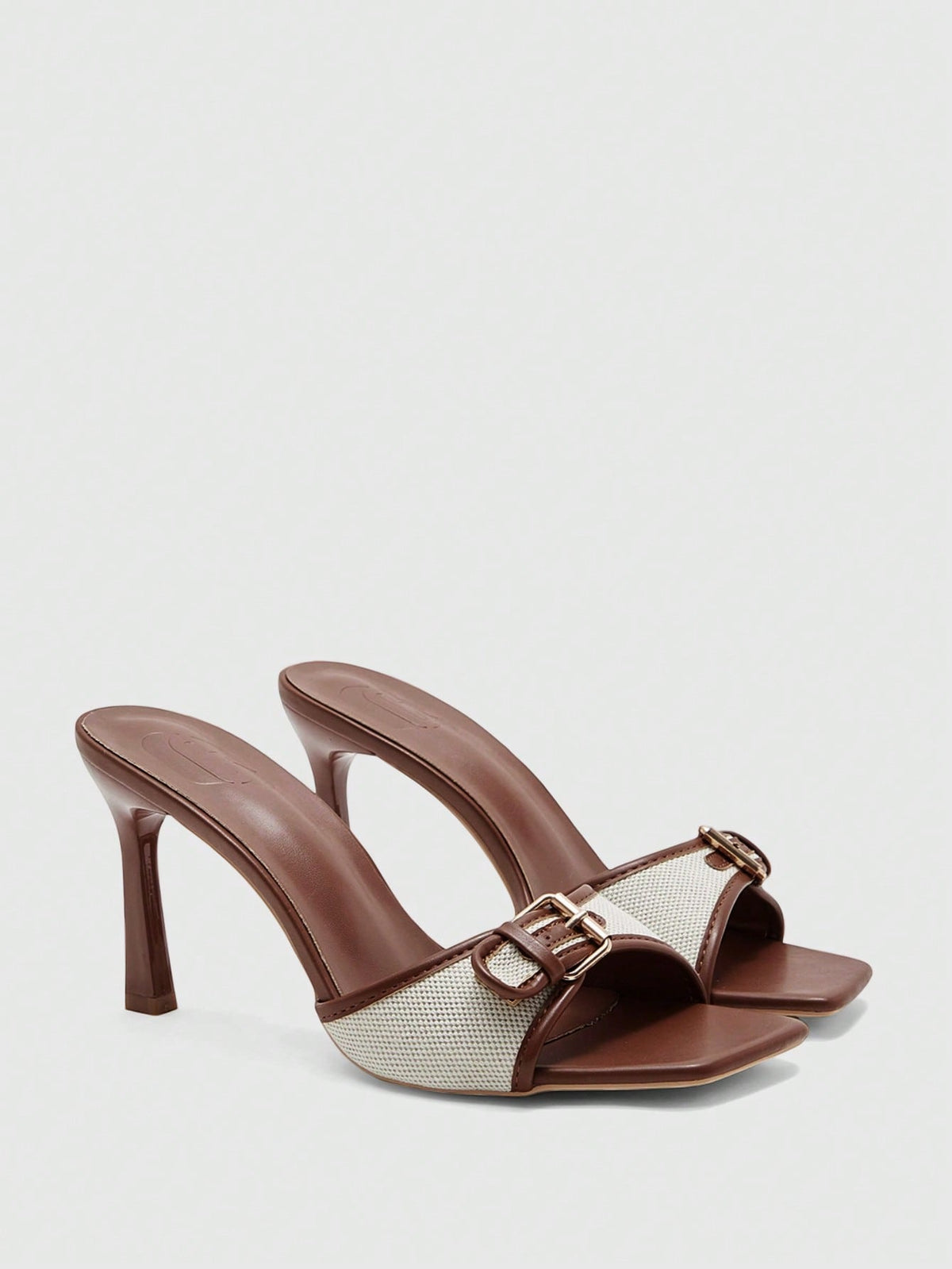 Women's brown open-toe slingback heeled sandals with stiletto heel and buckle strap.