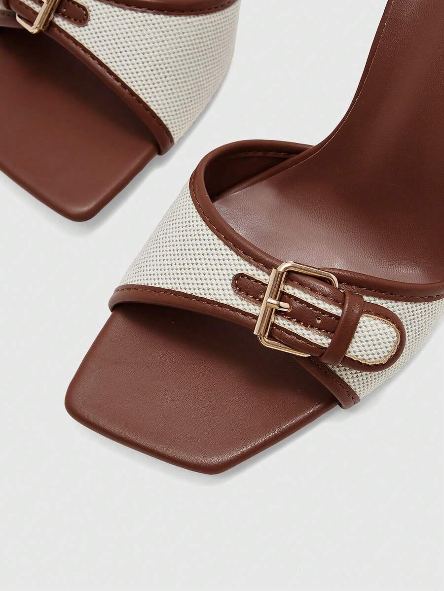 Women's brown open-toe slingback heeled sandals with stiletto heel and buckle strap.