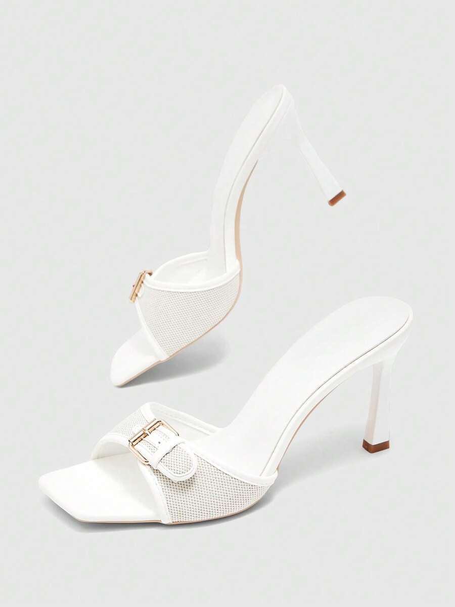 Women's brown open-toe slingback heeled sandals with stiletto heel and buckle strap.