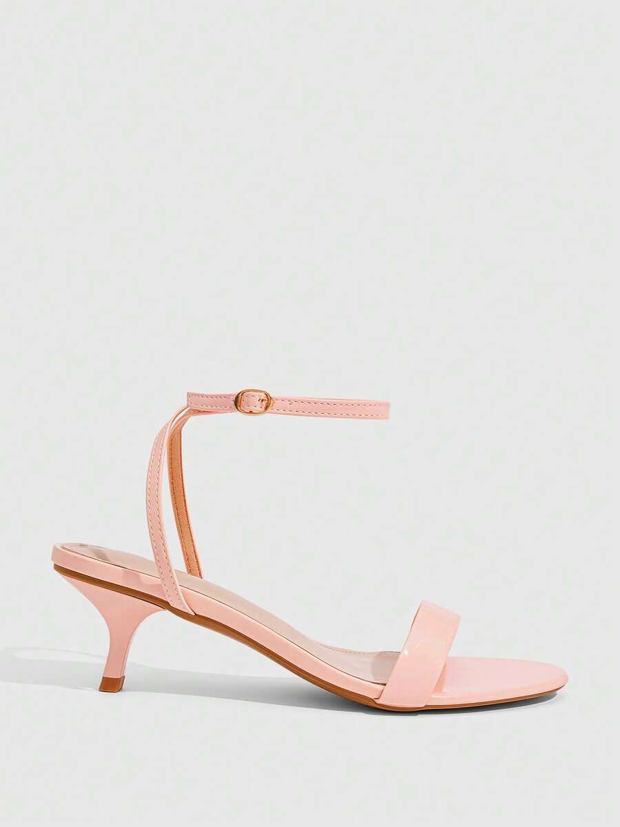Women's open-toed high-heeled sandals featuring a 5.5cm kitten heel stiletto, sleek ankle strap with buckle closure, and smooth PU leather finish.
