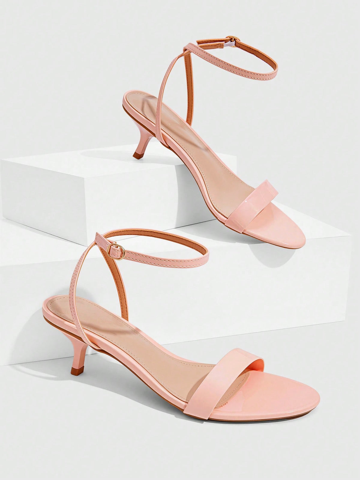 Women's open-toed high-heeled sandals featuring a 5.5cm kitten heel stiletto, sleek ankle strap with buckle closure, and smooth PU leather finish.