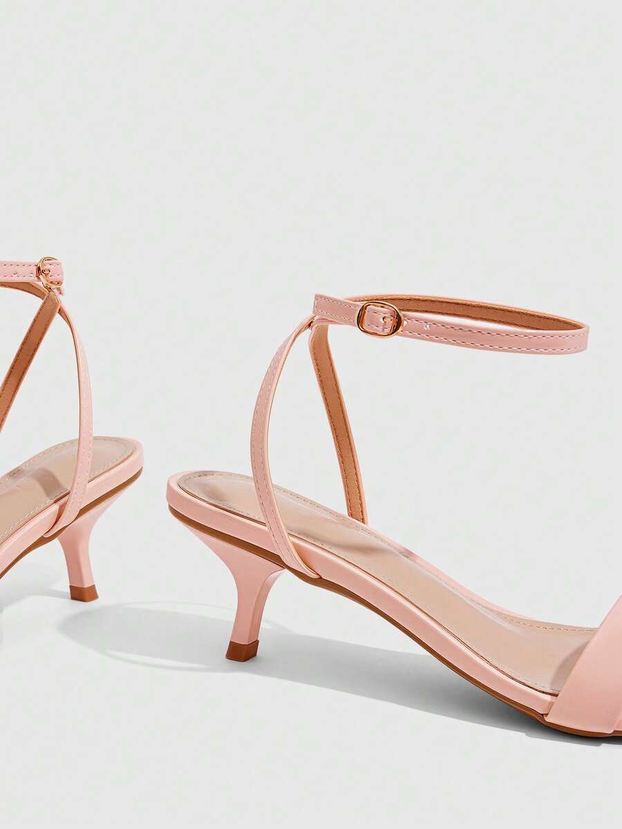 Women's open-toed high-heeled sandals featuring a 5.5cm kitten heel stiletto, sleek ankle strap with buckle closure, and smooth PU leather finish.
