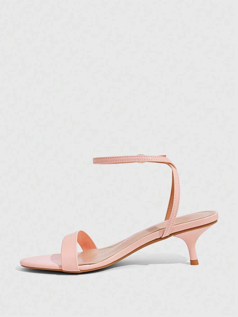 Women's open-toed high-heeled sandals featuring a 5.5cm kitten heel stiletto, sleek ankle strap with buckle closure, and smooth PU leather finish.