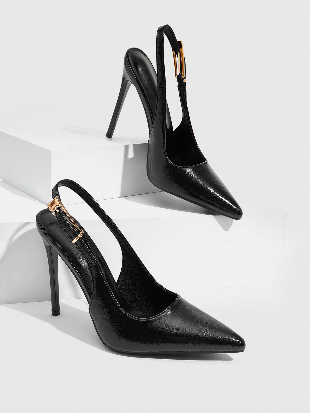 Pointed toe stiletto high heel evening party pumps featuring an ankle strap with buckle closure.