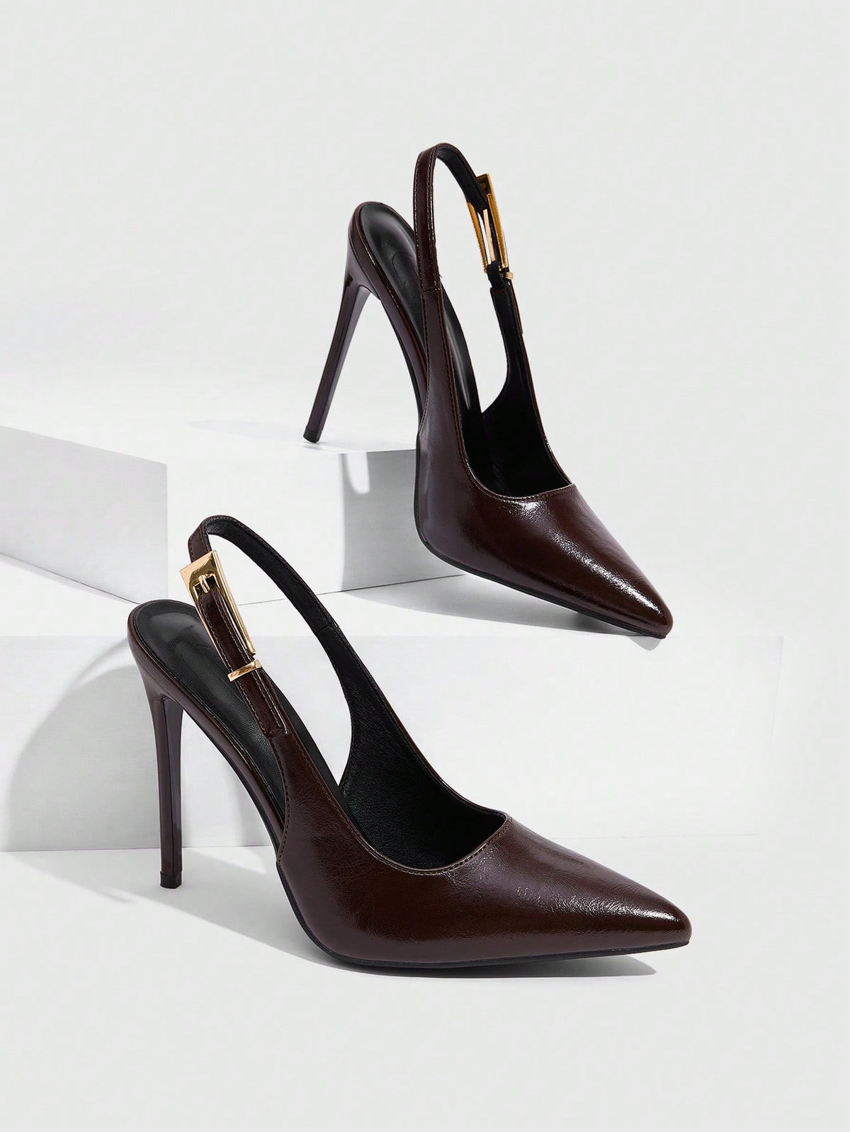 Pointed toe stiletto high heel evening party pumps featuring an ankle strap with buckle closure.