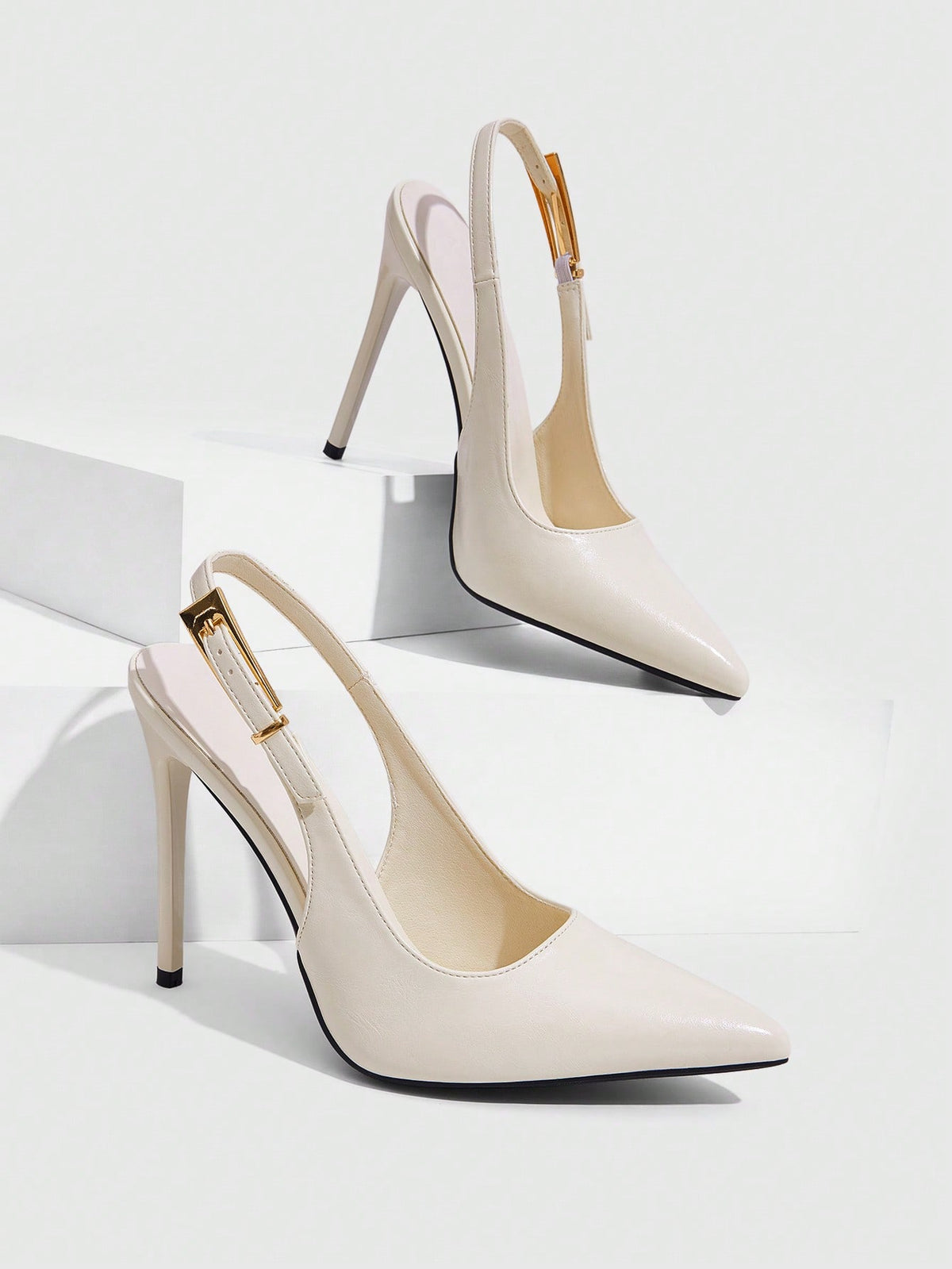 Pointed toe stiletto high heel evening party pumps featuring an ankle strap with buckle closure.