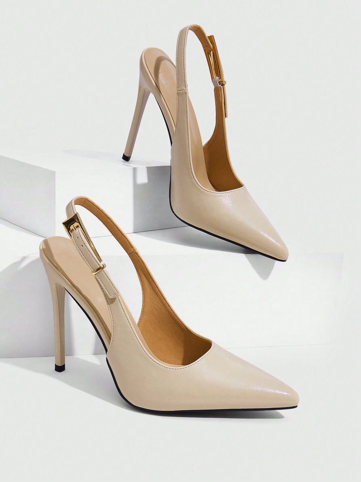 Pointed toe stiletto high heel evening party pumps featuring an ankle strap with buckle closure.
