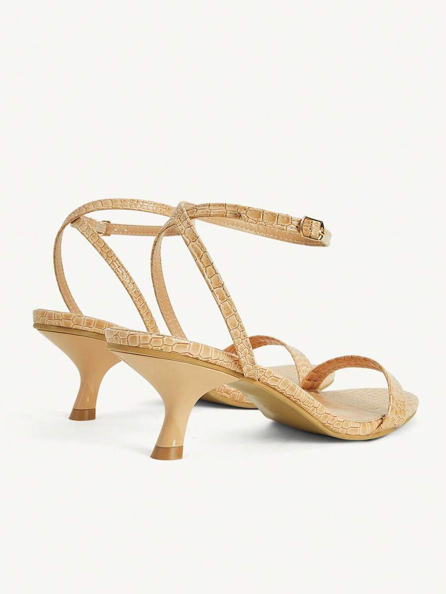 Women's open-toed high-heeled sandals featuring a 5.5cm kitten heel stiletto, sleek ankle strap with buckle closure, and smooth PU leather finish.