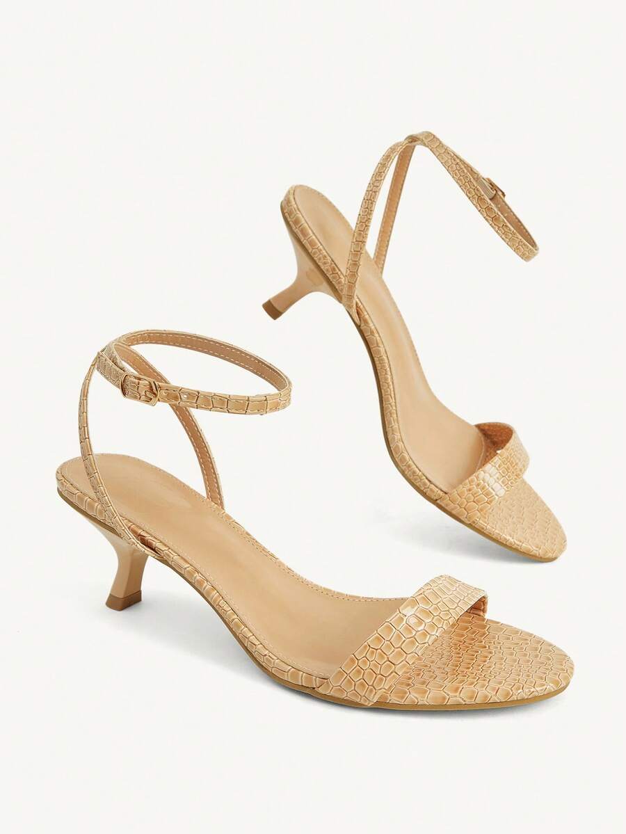 Women's open-toed high-heeled sandals featuring a 5.5cm kitten heel stiletto, sleek ankle strap with buckle closure, and smooth PU leather finish.
