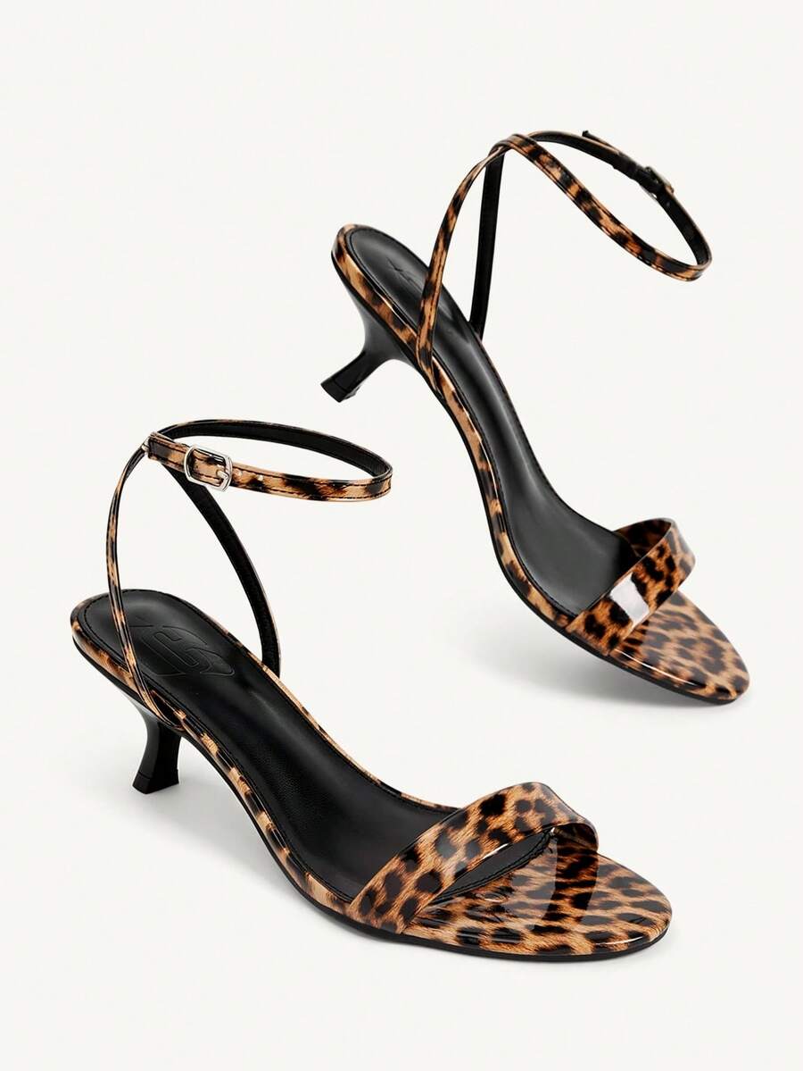 Women's open-toed high-heeled sandals featuring a 5.5cm kitten heel stiletto, sleek ankle strap with buckle closure, and smooth PU leather finish.