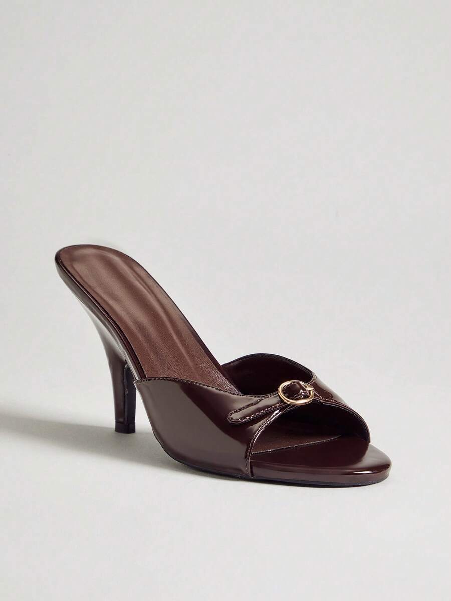 Women's slip-on heeled sandals with metal-coated stiletto heels and lock decoration in chocolate brown PU leather.