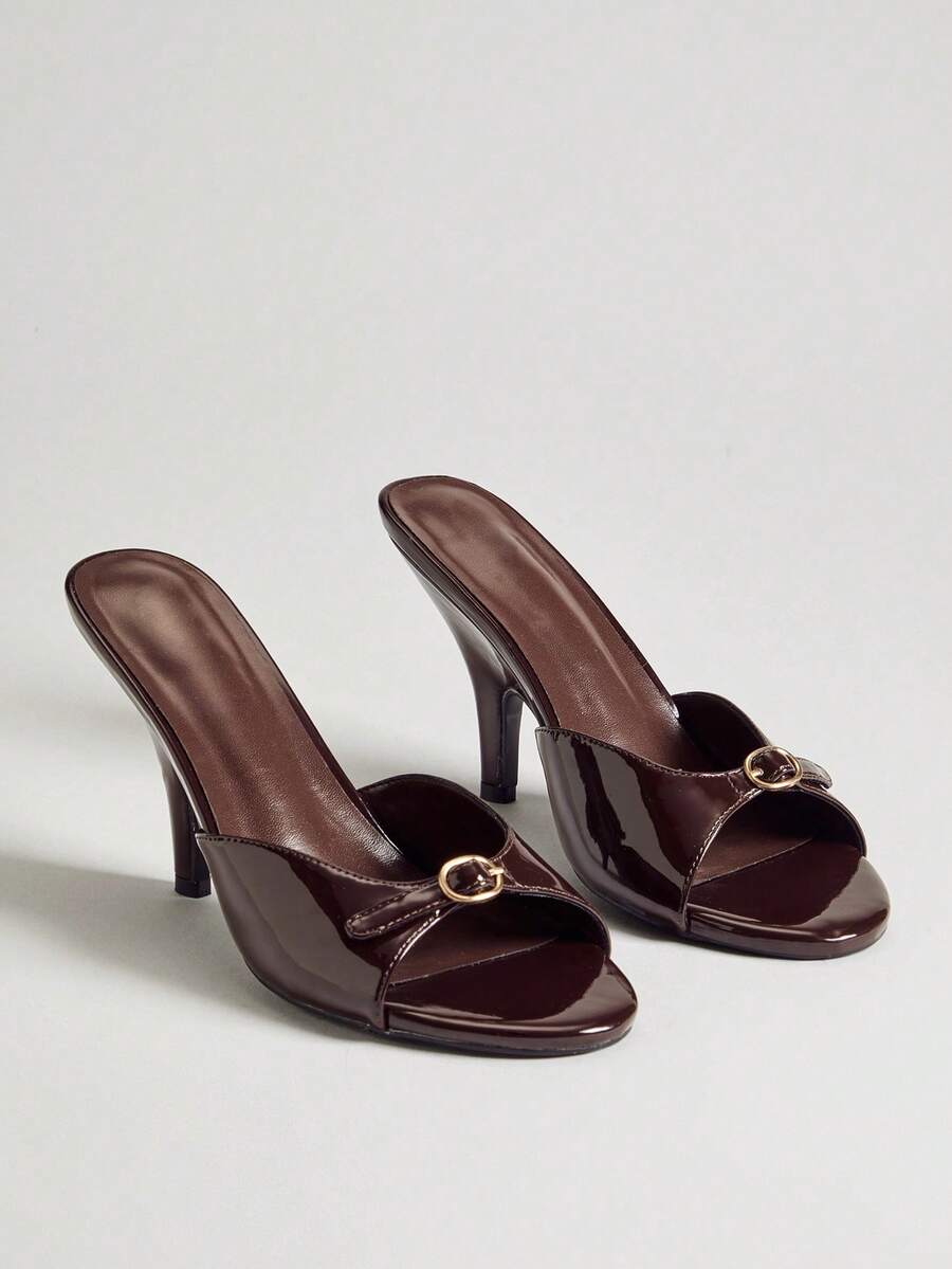 Women's slip-on heeled sandals with metal-coated stiletto heels and lock decoration in chocolate brown PU leather.
