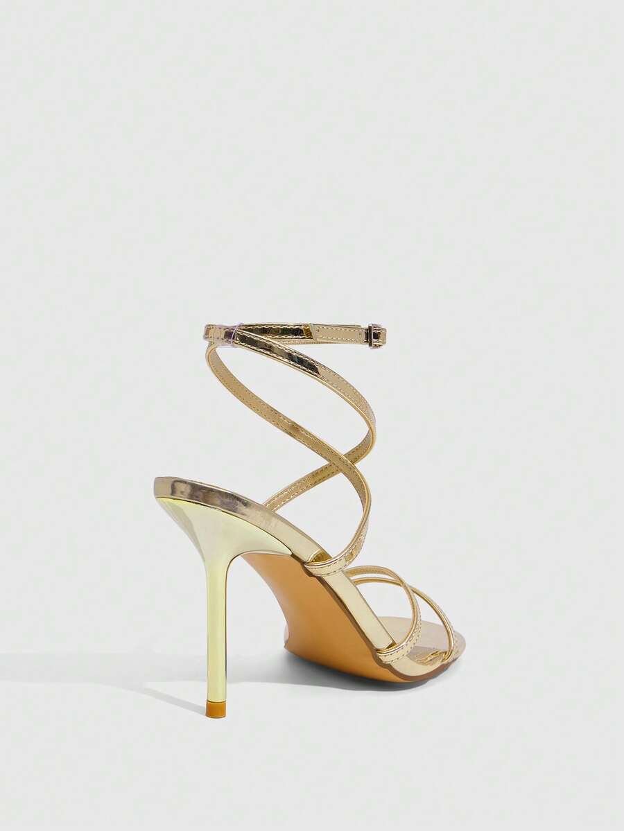 Women's square toe stiletto high heeled sandals with ankle strap buckle in a sleek faux leather finish.