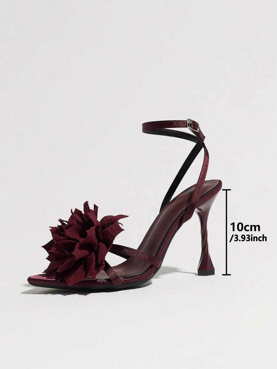 Women's black open toe stiletto heel sandals featuring lace mesh detailing, wide strap styling, and high stiletto heels.