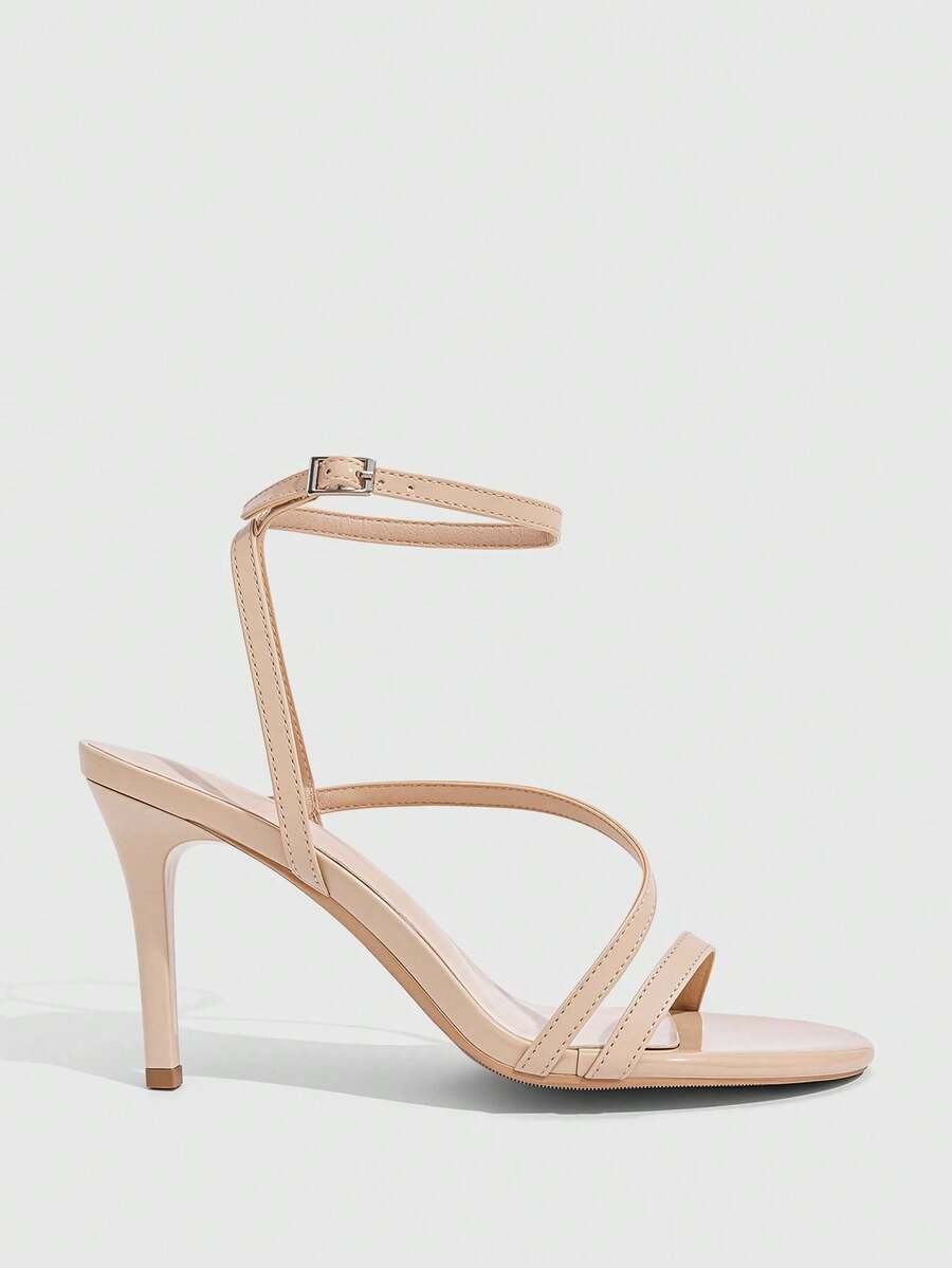 Women's silver stiletto high-heeled sandals with cross straps, buckle fastening, and open round toe.