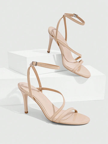 Women's silver stiletto high-heeled sandals with cross straps, buckle fastening, and open round toe.