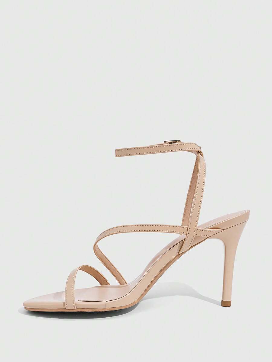 Women's silver stiletto high-heeled sandals with cross straps, buckle fastening, and open round toe.