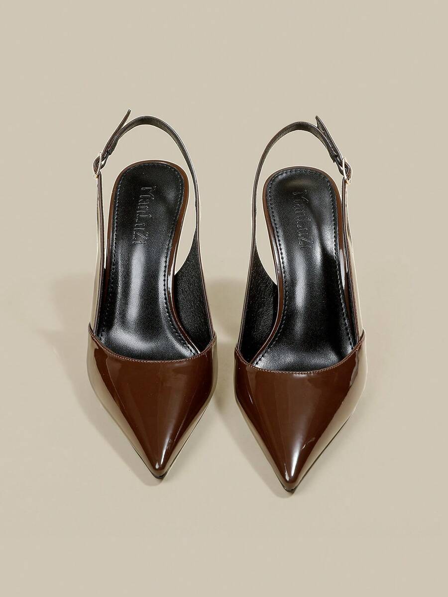 Women's pointed toe kitten heel pumps with adjustable buckle back strap and sleek patent finish.