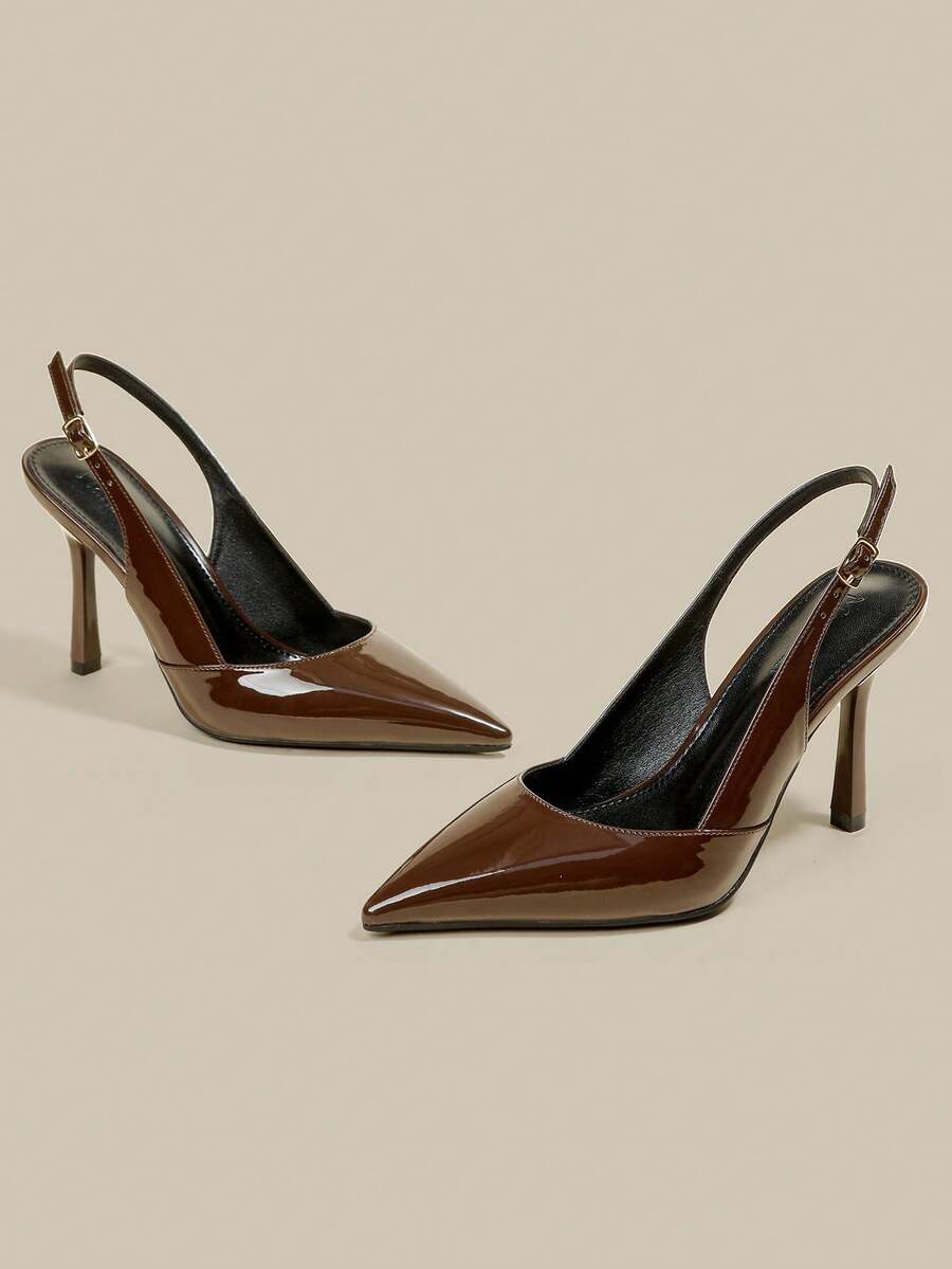Women's pointed toe kitten heel pumps with adjustable buckle back strap and sleek patent finish.