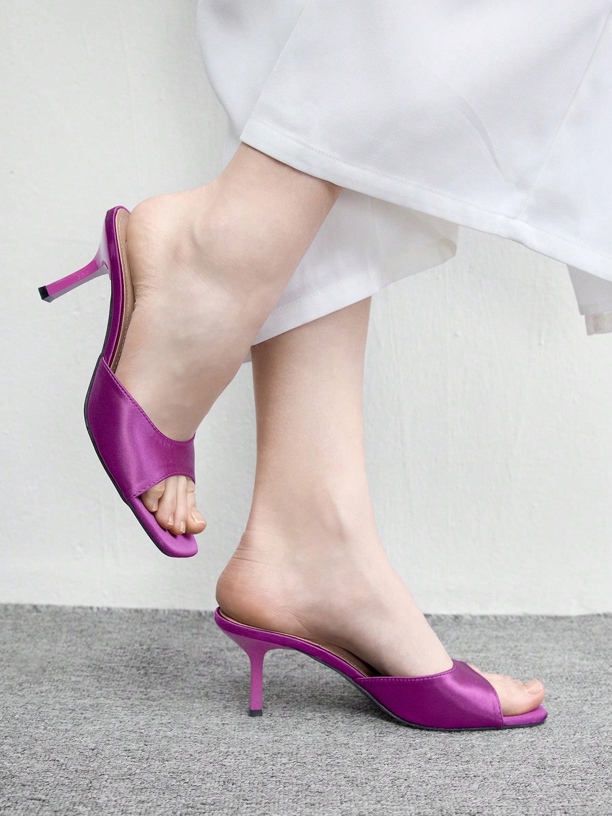 Women's black square toe high heel sandals featuring an open toe design, thin stiletto heel, and slingback strap.