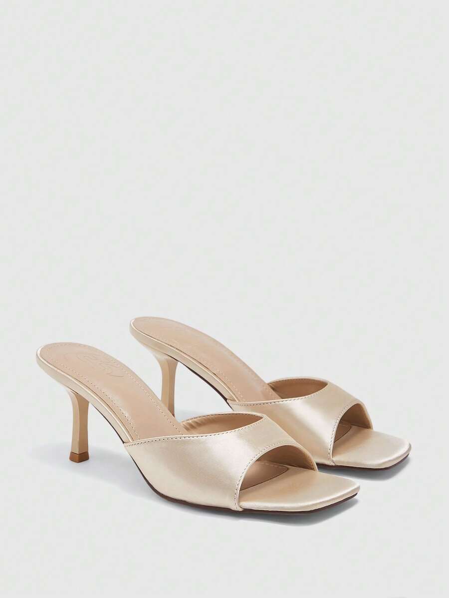 Women's black square toe high heel sandals featuring an open toe design, thin stiletto heel, and slingback strap.