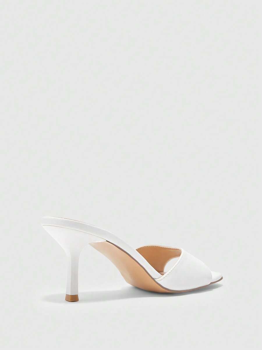 Women's black square toe high heel sandals featuring an open toe design, thin stiletto heel, and slingback strap.