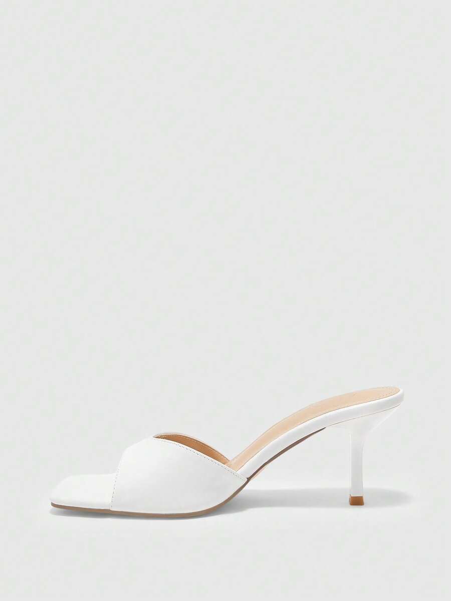 Women's black square toe high heel sandals featuring an open toe design, thin stiletto heel, and slingback strap.