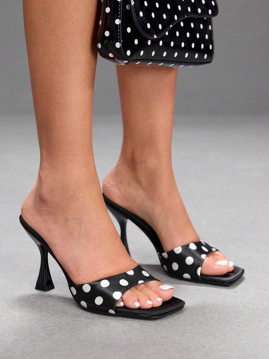 Women's open square toe slender high heel sandals with slingback strap and metal buckle detailing.