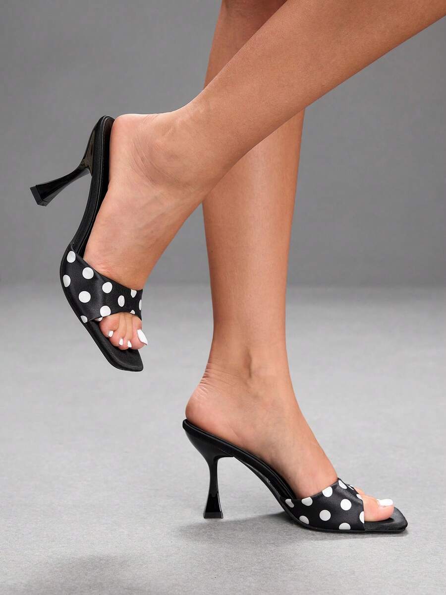 Women's open square toe slender high heel sandals with slingback strap and metal buckle detailing.
