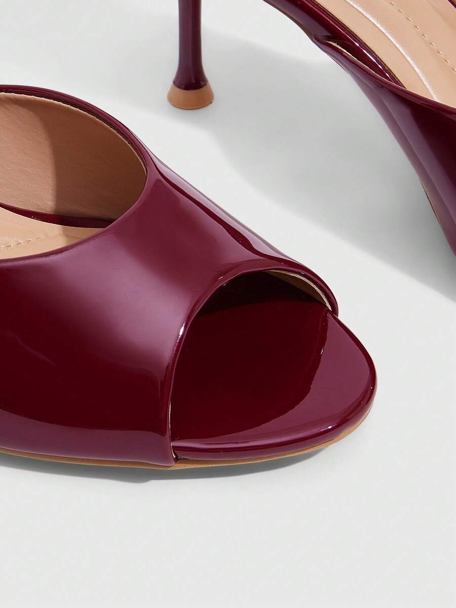 Pair of women's open toe high heel slingback sandals made with smooth PU leather