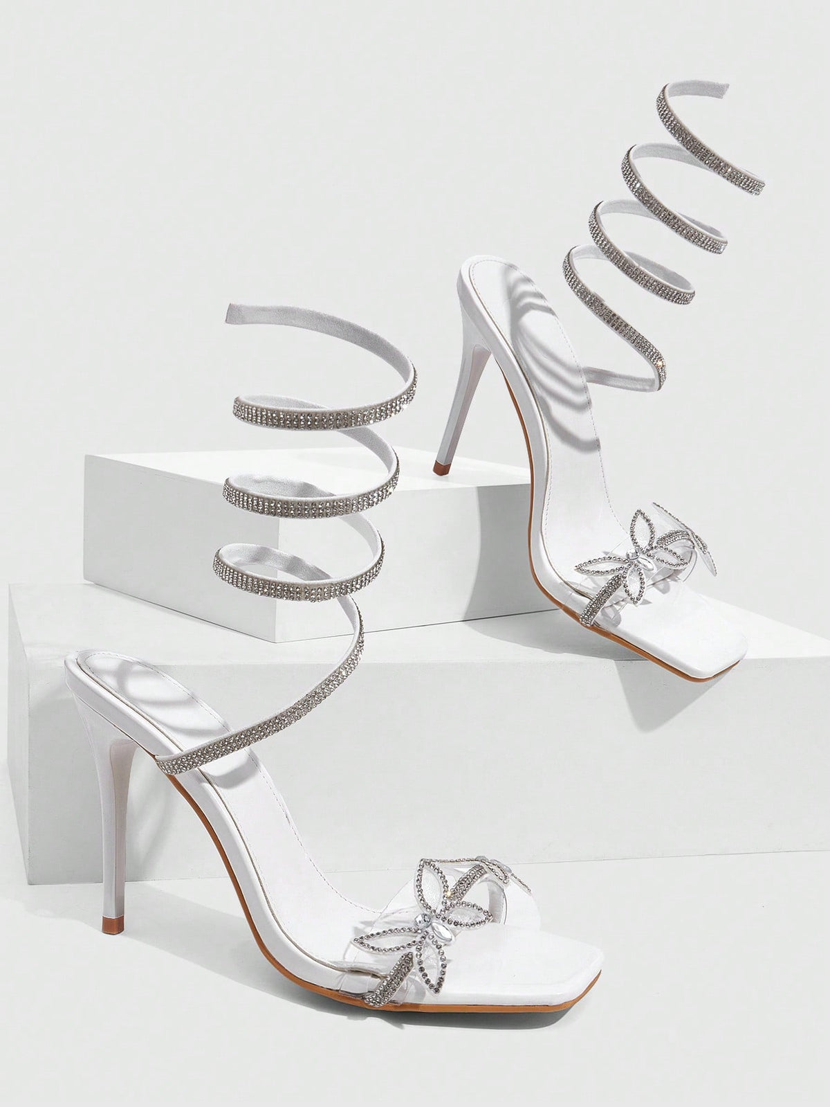 Women's square toe high heel slingback sandals featuring sparkling rhinestone floral accents, an open toe design, and sleek stiletto heels for summer parties.