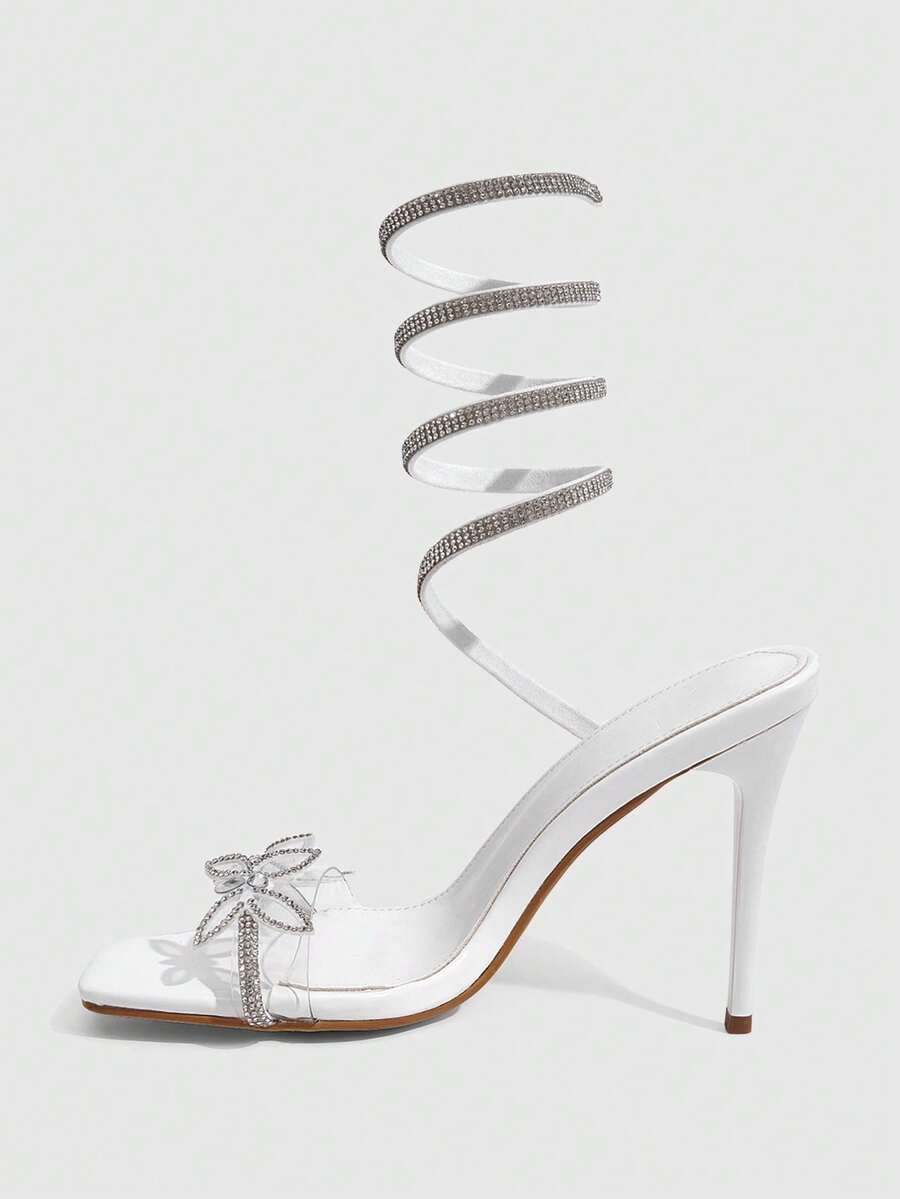 Women's square toe high heel slingback sandals featuring sparkling rhinestone floral accents, an open toe design, and sleek stiletto heels for summer parties.