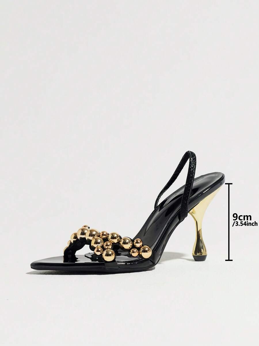 Pointed toe party high heels in gold featuring wavy lace trim, a stiletto heel, and back tie slingback straps.
