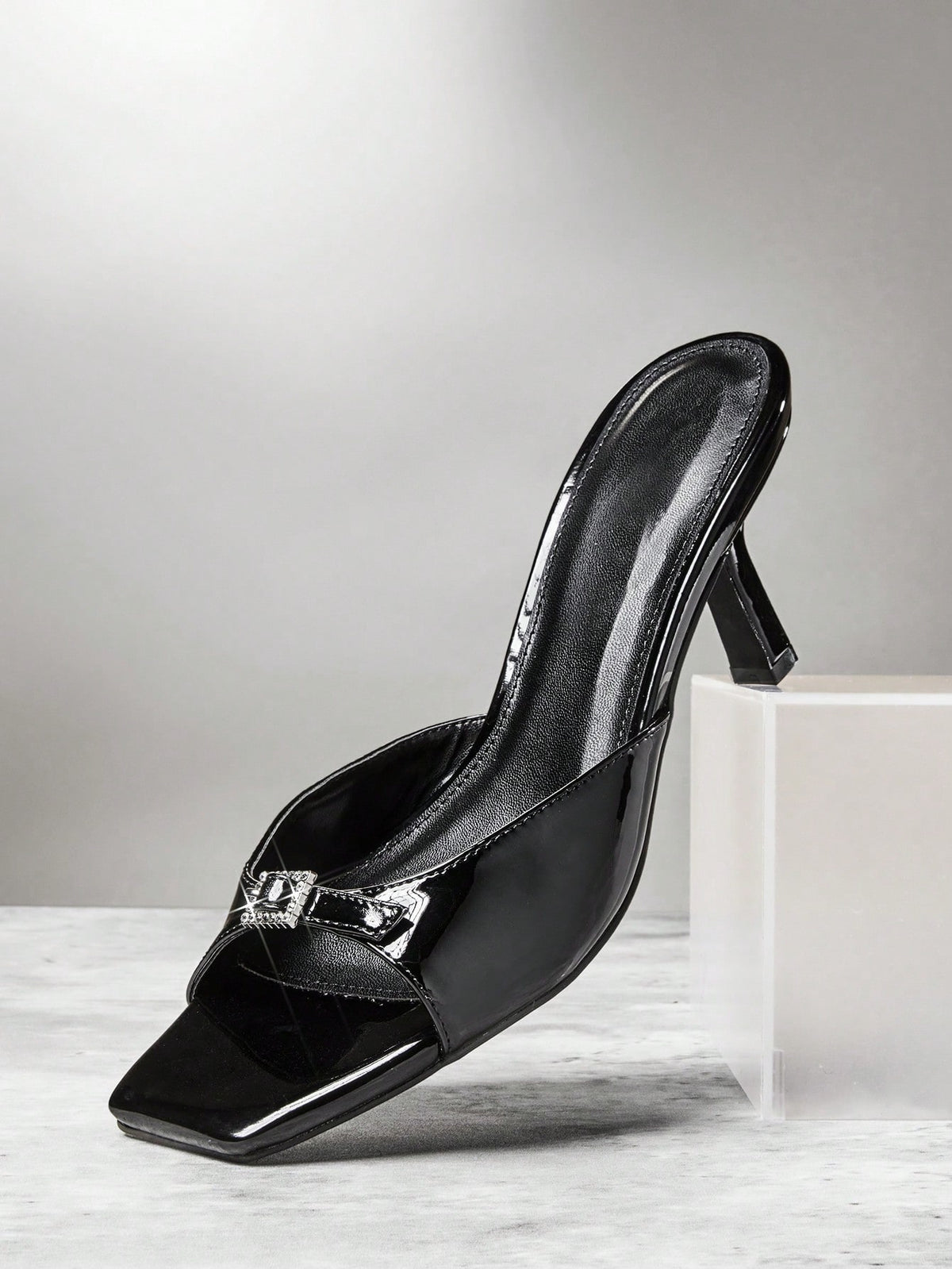 Women's pointed toe stiletto high heel wedding shoes featuring an elegant silhouette and glossy finish.
