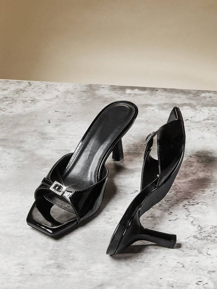 Women's pointed toe stiletto high heel wedding shoes featuring an elegant silhouette and glossy finish.