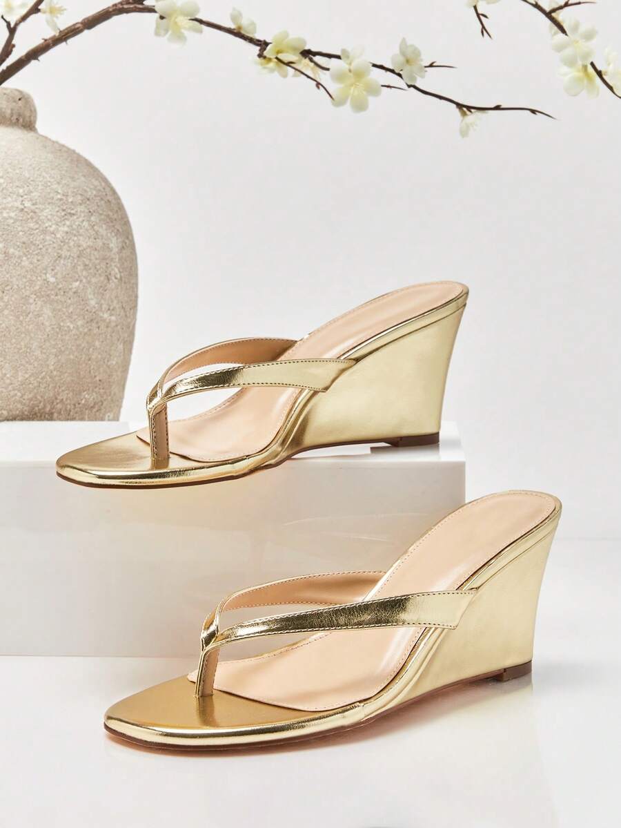 Women's faux suede thong wedge sandals featuring rope detail and high platform wedge sole
