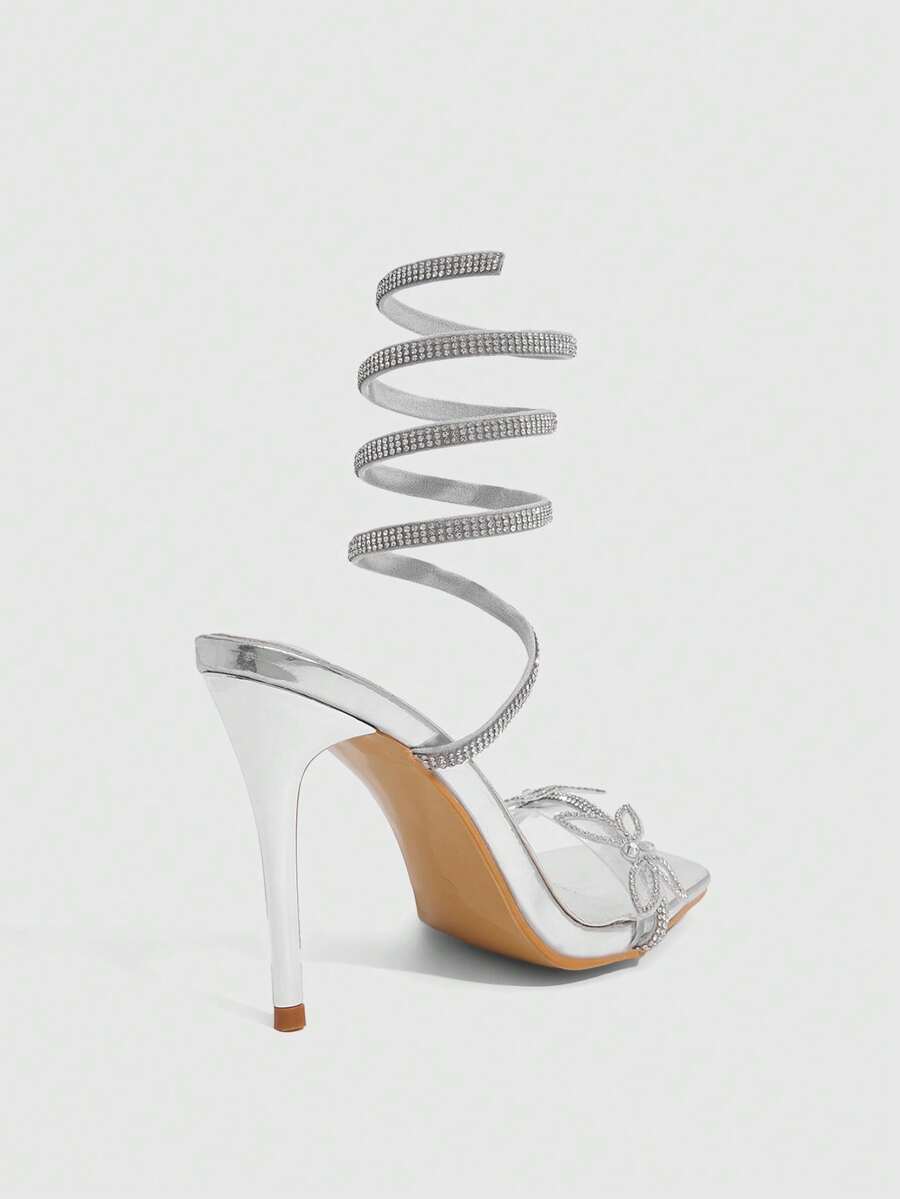 Women's square toe high heel slingback sandals featuring sparkling rhinestone floral accents, an open toe design, and sleek stiletto heels for summer parties.