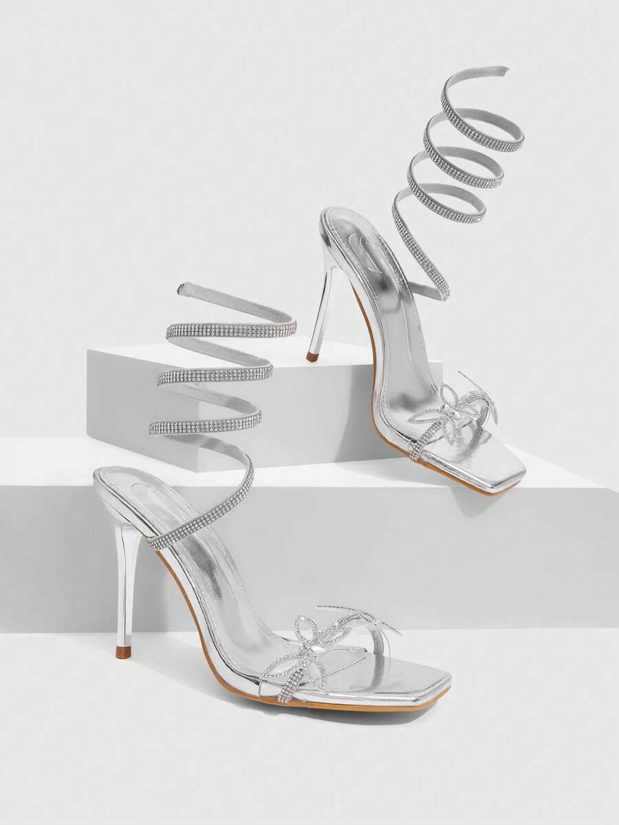 Women's square toe high heel slingback sandals featuring sparkling rhinestone floral accents, an open toe design, and sleek stiletto heels for summer parties.