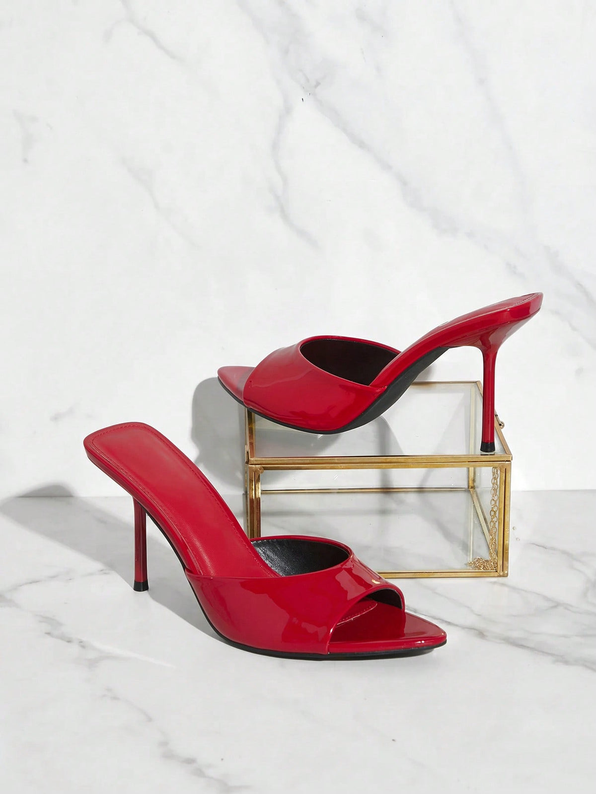 Women's pointed toe stiletto high heel wedding shoes featuring an elegant silhouette and glossy finish.
