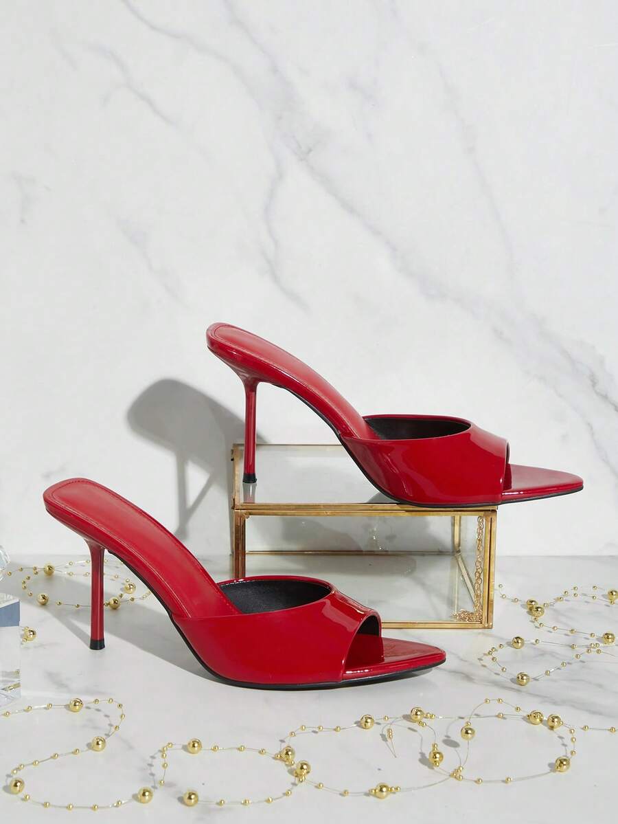 Women's pointed toe stiletto high heel wedding shoes featuring an elegant silhouette and glossy finish.