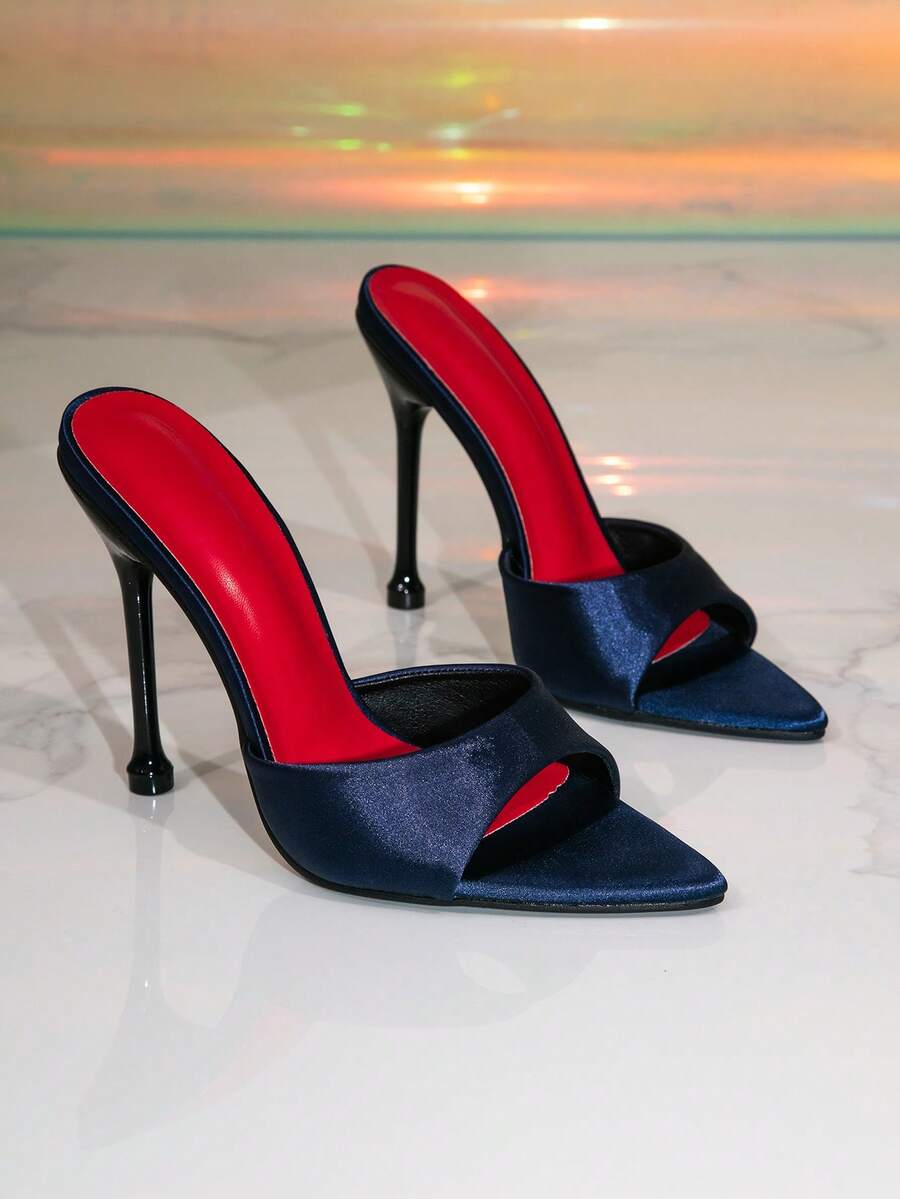 Women's pointed toe high heel mule sandals featuring stiletto heels and decorative accents for party wear.