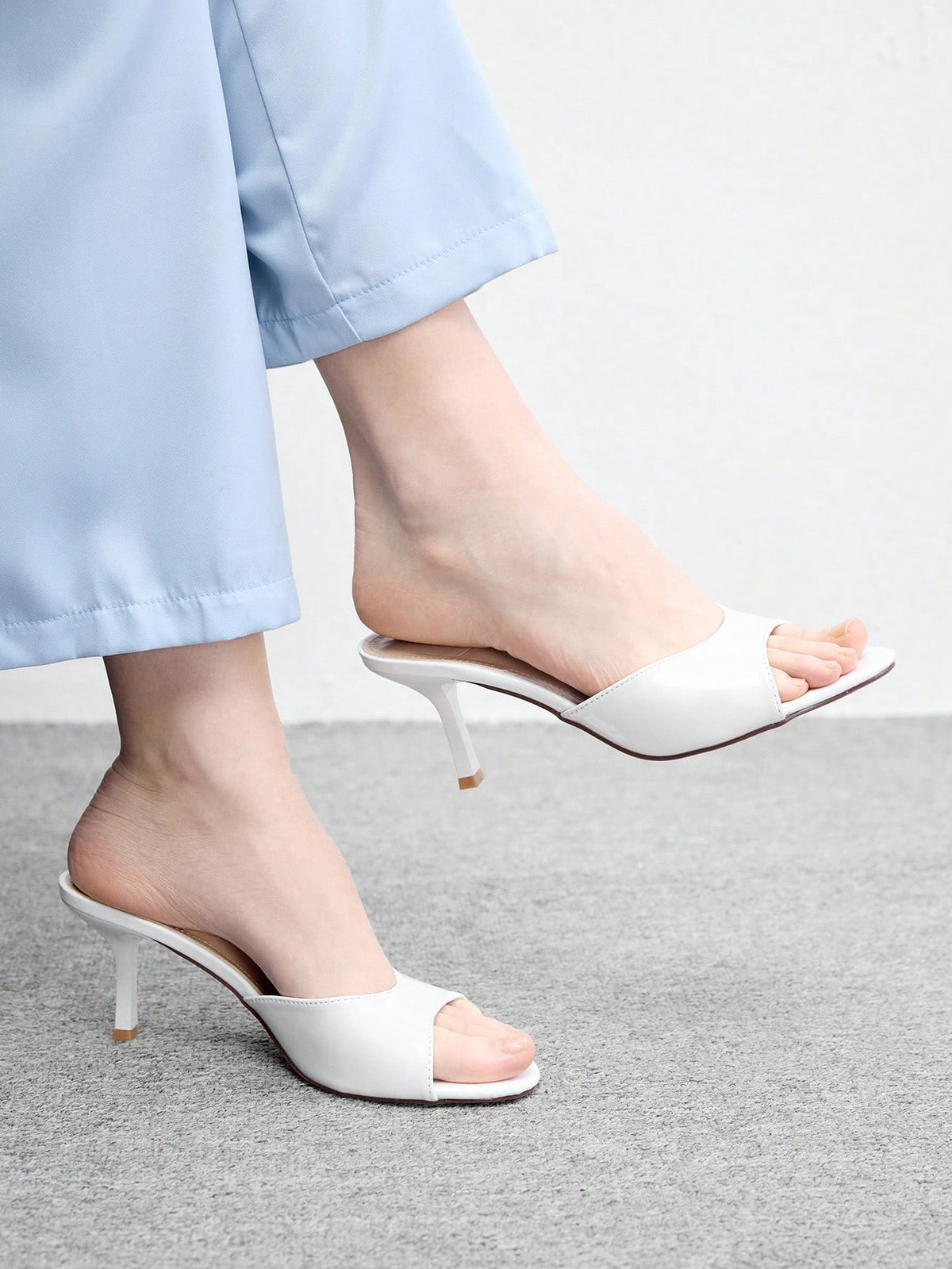Pair of women's open toe high heel slingback sandals made with smooth PU leather
