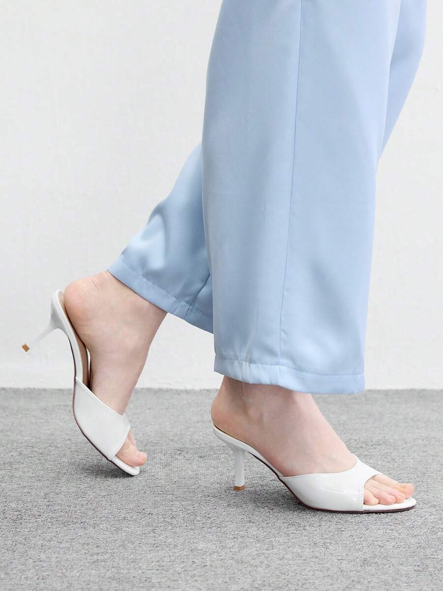 Pair of women's open toe high heel slingback sandals made with smooth PU leather